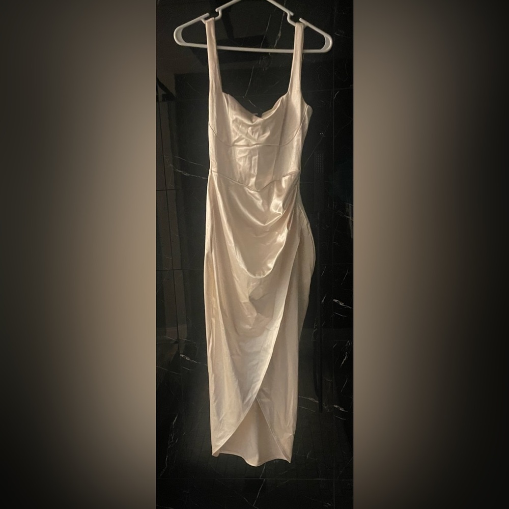 Selling a size small pretty pearl colored dress for any occasion.Never been worn